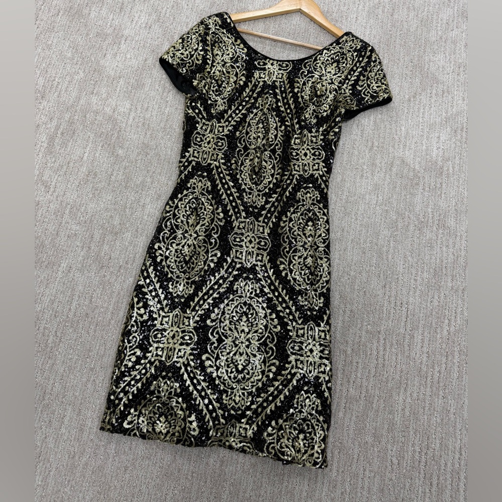 Black and gold sequin dress